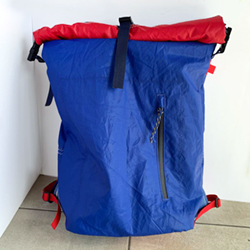 Roll top backpack made with recycled sails